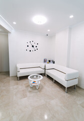 Interior of modern private clinic. Indoor empty medical hall.
