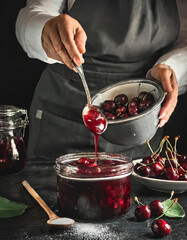 Woman preparing cherry jam