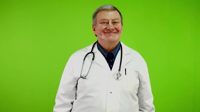 Doctor looking at camera nodding head says yes.