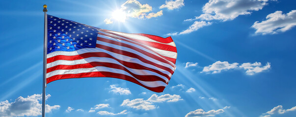 Waving American flag. Sunny day with white clouds.
