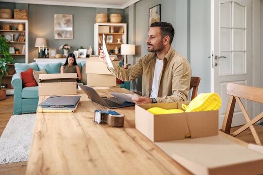 Man thriving in home office with dropshipping business