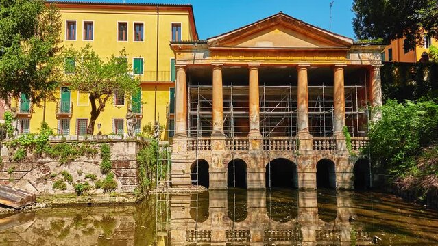 Loggia, situated inside Salvi Garden, rises on waters of Seriola. Valmarana Salvi gardens are public garden located in historic center of Vicenza, Italy, adjacent to walls of Piazza Castello.