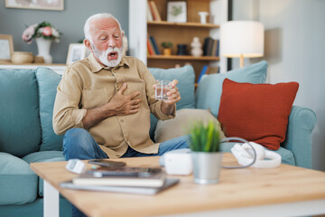 Man coping with high blood pressure at home