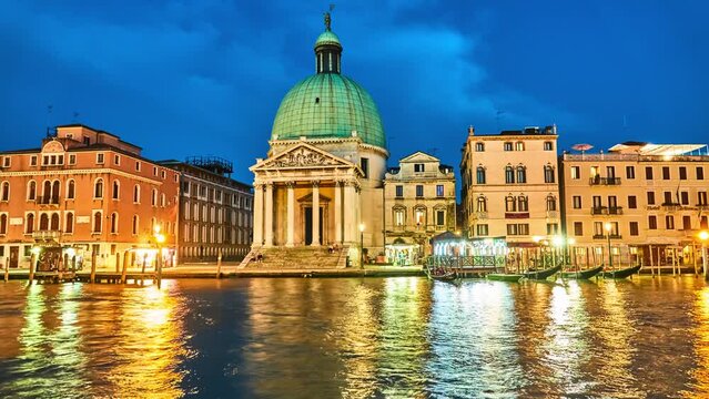 VENICE, ITALY - APRIL 23, 2018: View on San Simeone Piccolo and Grand Channel. Night by light of lanterns old. San Simeone e Giuda is church in sestiere of Santa Croce in Venice, northern Italy.