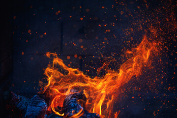 abstract fire in fireplace with tongues of flame and sparks