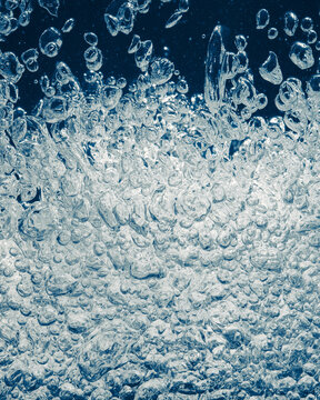 underwater splash bubbles in blue water environment