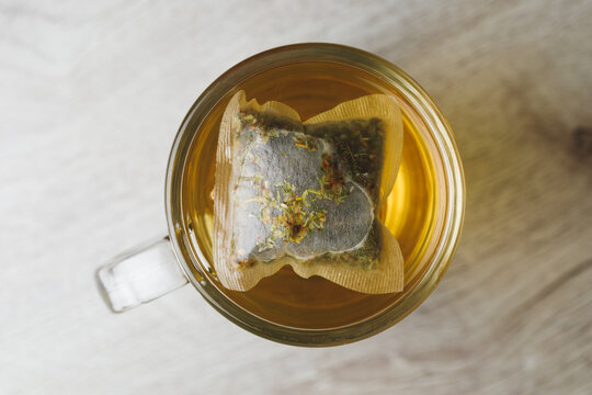 herbal tea in transparent cup, top view