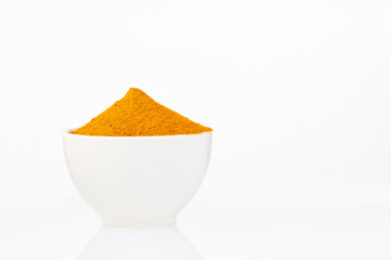 Fototapeta na wymiar Organic turmeric powder in the bowl - Curcuma longa