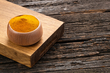 Organic turmeric powder in the bowl - Curcuma longa