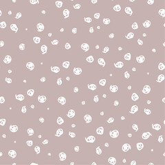 Seamless pattern with cute pretty  little doodle hand drawn white polka dots on beige background