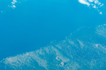 Fototapeta na wymiar Aerial photography of Honolulu to Hilo from the plane. Lava flows on the southwestern coast of Maui 