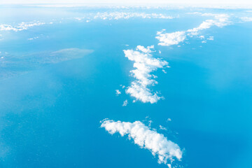Naklejka premium Aerial photography of Honolulu to Hilo from the plane. Kahoʻolawe , anglicized as Kahoolawe is the smallest of the eight main volcanic islands of the Hawaiian Islands. 
