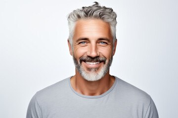 Photo portrait of a handsome 40s old mature man smiling with clean teeth. For a dental ad. Man with fresh stylish hair and beard, grey T-shirt. Isolated on white background - obrazy, fototapety, plakaty
