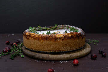 Cheesecake with cranberries. Christmas cake. Rustic style