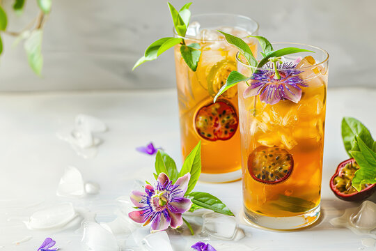 Glass of fresh passion fruit Lemonade in summer greenery and Flowers. Image for Cafe and Restaurant Menus