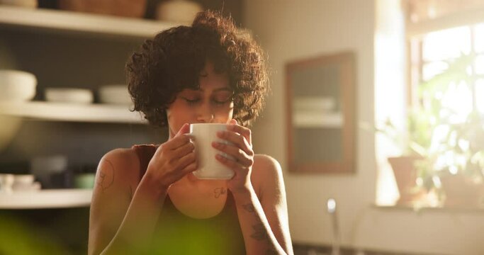 Woman, smelling coffee and scent on morning, calm and relaxing with hot beverage at home. Female person, thoughtful and peaceful drink or contemplation on weekend, daydreaming and aroma in kitchen