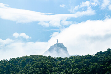Christ the Redeemer Landmark Rising Over Clouds and Mist of Mountains in Rio De Janeiro Brazil
