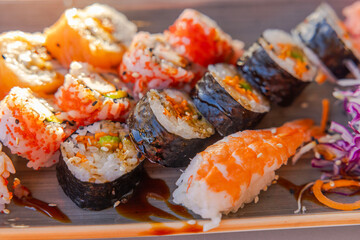 Close-up view of assorted sushi, including rolls, on a plate. Curacao.