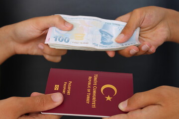 The hands of two men holding Turkish passports.. Buying a passport for money. fake passport.