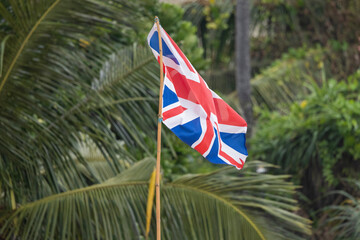 UK flag flying in wind on Bentota Beach, southern Sri Lanka