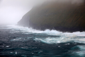 Waves crashing at the coastline of the Faroe islands