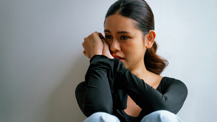 Depressed young Asian woman with mental health problem in mind need uttermost treatment from...