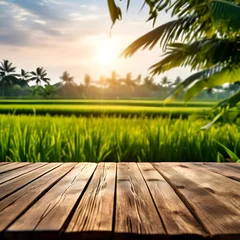 Fotobehang Wooden table in blurred nature with rice field background © Muh Saleh