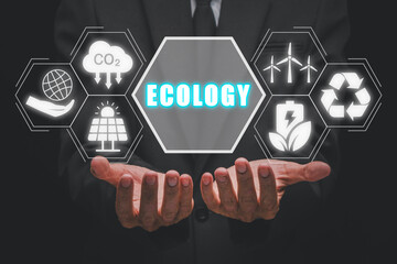 Ecology concept, Businessman hand holding ecology icon on virtual screen.