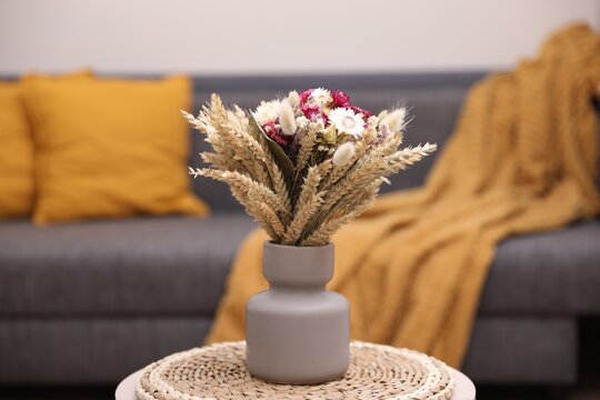 Bouquet Of Beautiful Dry Flowers And Spikelets In Vase On Side Table At Home