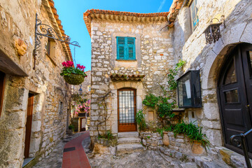 The narrow hillside alleys and streets of shops and cafes inside the medieval hilltop village of Eze, France, along the Cote d'Azur French Riviera.	