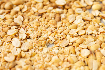 angle view ground peanuts as background and texture