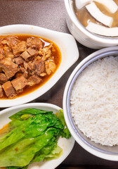top view five-spice beef brisket rice and coconut chicken soup with mushrooms at vertical composition