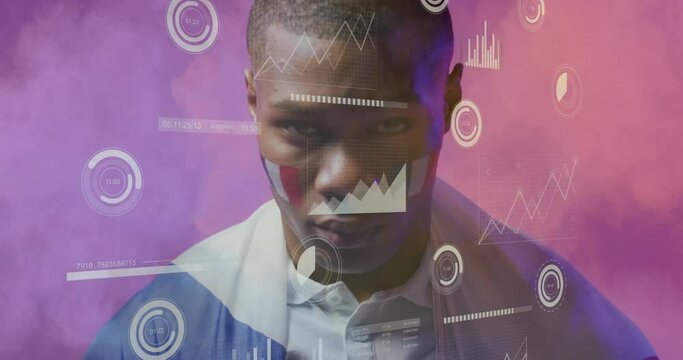 Animation of charts processing data over african american male sports fan with french flag on face