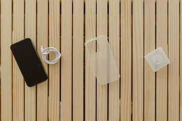 Smart mobile phone wear matte white case and cable case with phone standing function.