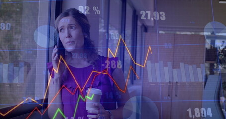 Image of financial data processing over caucasian businesswoman working in office