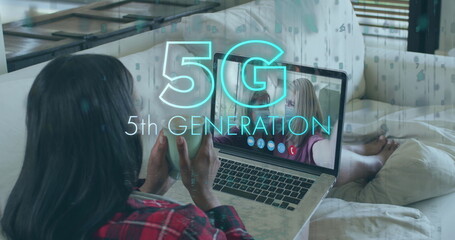 Image of 5g 5th generation text over woman using laptop on image call in background