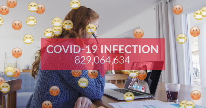Image of emojis in face masks, number of covid 19 cases over woman using laptop on image call - Powered by Adobe