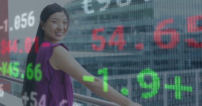 Image of financial data processing over asian businesswoman smiling on office's balcony