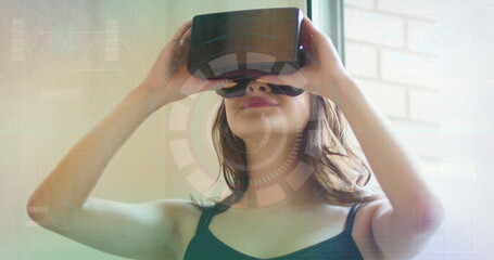 Image of scope scanning over woman using vr headset
