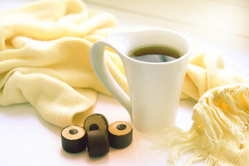 Cup of coffee and candy sweet with peanut butter. Luxury dessert