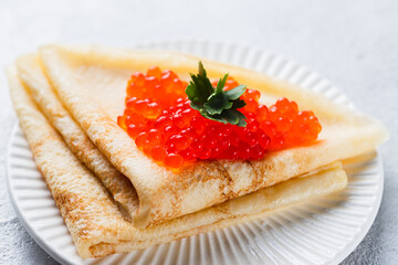 Pancakes with red caviar filling