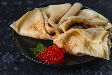 Pancakes with red caviar filling
