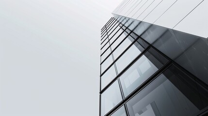 Fototapeta premium Bottom view of modern skyscraper. Business concept of successful industrial architecture.