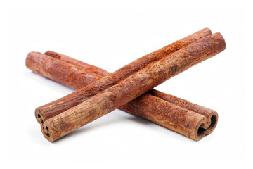 Cinnamon sticks crossed over each other on a white backdrop