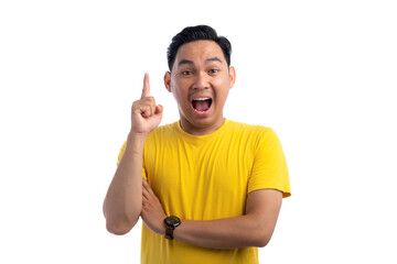Excited handsome Asian man pointing finger up at copy space, having creative idea isolated on white background