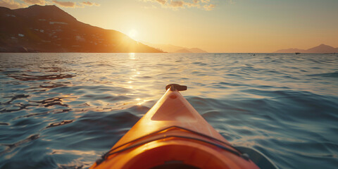 A tranquil scene of kayaking at sunset, with warm light reflecting on gentle sea waves.