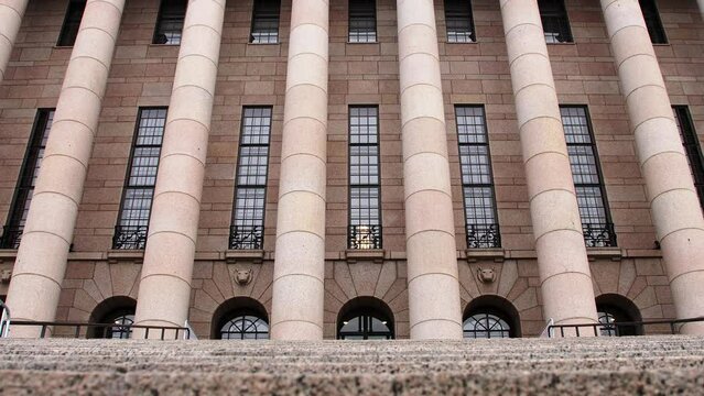 Classical architecture of Helsinki Parliament House, grand columns, daytime, no people, wide shot slow zoom in