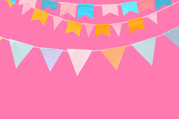 Colorful flags for Festa Junina on pink background