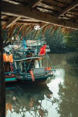 Fototapeta na wymiar Fisherman's village and fishing boats at the canal by the sea.​Fisherman's village and fishing boats at the canal by the sea.​Fisherman's village and fishing boats at the canal by the sea.​