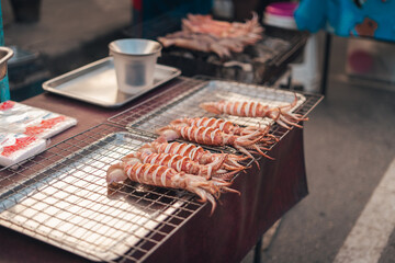 Squid grilled on a grill at a street market